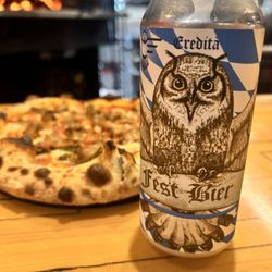 Get pizza here and drinks across the hall at everydaywines.