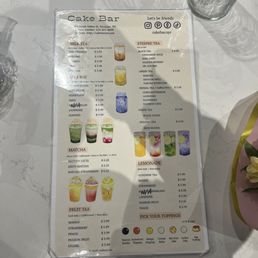 Menu - Cake Bar menu in Syracuse, NY offers milk teas, fruit teas, lemonades, and toppings, with colorful drink images and prices.
