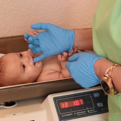 My Pure Delivery - Lactation Consultant giving baby an oral exam