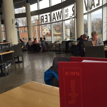Flavor - people sitting at tables in a library - Canadian (New) Near Me - Sydney, Nova Scotia