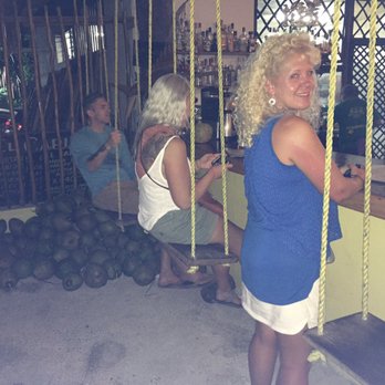 El Capitán - The swings are cool but the pile of coconuts is intriguing- ask them why. - Seafood Near Me - Tulum, ROO
