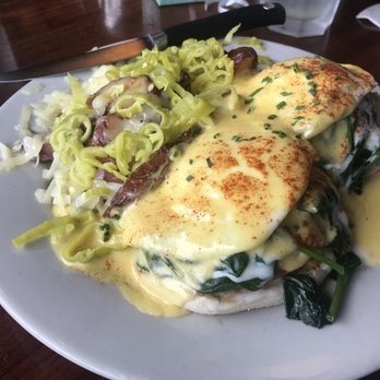 Uptown Cafe - Eggs Sardou (vegetarian), slices of tomato added. Side of homefries upgraded to add swiss cheese and peppers - Breakfast & Brunch Near Me - Bloomington, Indiana