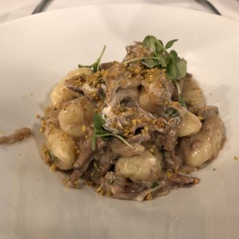At The Table - Duck Confit Gnocchi: shitake mushrooms, goat cheese, chives - New American Near Me - Wayne, Pennsylvania At The Table - Duck Confit Gnocchi: shitake mushrooms, goat cheese, chives - New American Near Me - Wayne, Pennsylvania