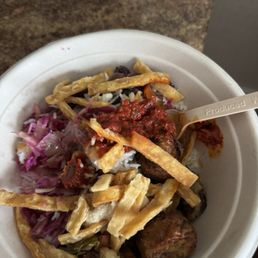 Saffron Rice with harissa, falafel, roasted veggies, cabbage and pita chips