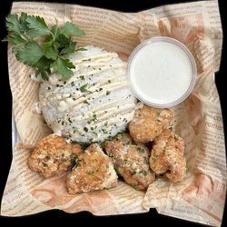 Manokan - Garlic Parmesan boneless wings with a side of rice topped with Sisig sauce