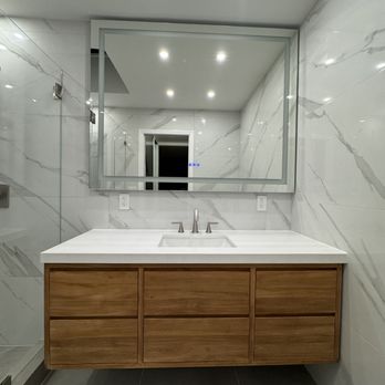 O.W. Builders - Bathroom remodel with floating vanity and smart mirror - Handyman Near Me O.W. Builders - Bathroom remodel with floating vanity and smart mirror - Handyman Near Me
