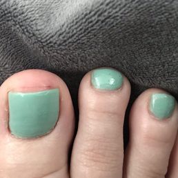 Cut all across the top of my big toe for nail file. Uneven paint.