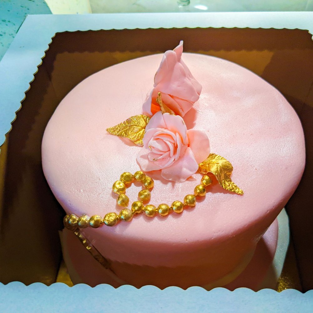 Elite Cakes - a pink cake with gold decorations - Custom Cakes Near Me - El Paso, Texas