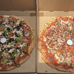 Large Big D deluxe and a mushroom & bacon. Large Big D deluxe and a mushroom & bacon.