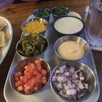 The District Tap - TDT Nachos-Chicken Chips on the side - Sports Bars Near Me - Indianapolis, Indiana