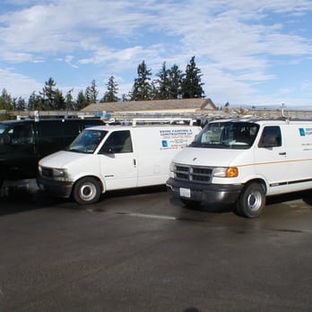 Brink Painting & Construction - two trucks in a parking lot - General Contractors Near Me Brink Painting & Construction - two trucks in a parking lot - General Contractors Near Me