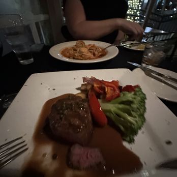 Magellan's - Filet mignon with peppercorn sauce Seafood pasta in the background - New American Near Me - Tracy, California Magellan's - Filet mignon with peppercorn sauce Seafood pasta in the background - New American Near Me - Tracy, California