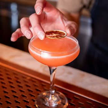 Forgotten Tonic - Garnishing the Naked & Famous cocktail - Wine Bars Near Me - Saint Augustine, Florida