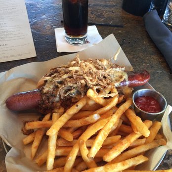 Biggio's - The Dirty Dog. Get your knife and fork. Ridiculously Texas sized. Covered in cheese sauce, bison chili and onion strings. - Sports Bars Near Me - Houston, Texas Biggio's - The Dirty Dog. Get your knife and fork. Ridiculously Texas sized. Covered in cheese sauce, bison chili and onion strings. - Sports Bars Near Me - Houston, Texas