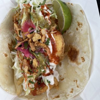 Dos Amigos Tacos - Fish taco with spicy sauce! They have fries at the bottom!! Super tasty !! - Food Trucks Near Me - Markham, Ontario