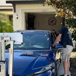 Mr. Auto Glass - Windshield replacement in a customer's driveway, with the ADAS calibration rig set up right on site.