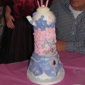 Sugarisms by Maica - a man and a woman looking at a cake - Custom Cakes Near Me Sugarisms by Maica - a man and a woman looking at a cake - Custom Cakes Near Me