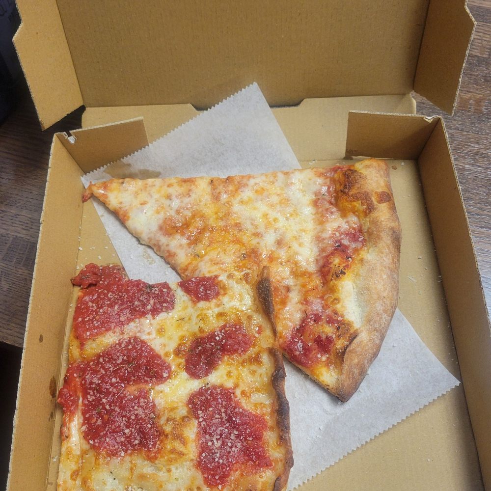 Gigis Pizza - Grandma slice and regular slice. - Pizza Near Me - New Hyde Park, New York Gigis Pizza - Grandma slice and regular slice. - Pizza Near Me - New Hyde Park, New York