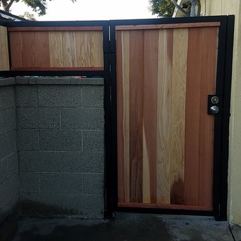 LMR Fencing - Heavy duty metal frame and red wood fencing and door. - Fences & Gates Near Me