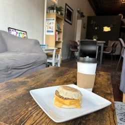 Country Gourmet - Breakfast sandwich with sausage and a Carmel latte with an extra shot of espresso.