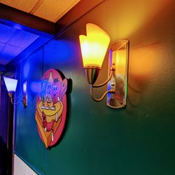 Dar's Double Scoop - Sconce lighting with personified vegetables riding on top of a cartoon pizza. A cool hot dog nearby is admiring their work greatly.