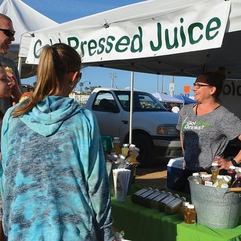 The Market at North Beach - a woman talking to a man - Farmers Market Near Me - San Clemente, California The Market at North Beach - a woman talking to a man - Farmers Market Near Me - San Clemente, California