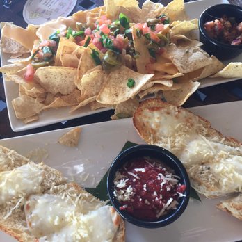 Kona Brewing - Happy hour cheesy garlic bread ($3) and small nachos ($10). - Pubs Near Me - Honolulu, Hawaii Kona Brewing - Happy hour cheesy garlic bread ($3) and small nachos ($10). - Pubs Near Me - Honolulu, Hawaii