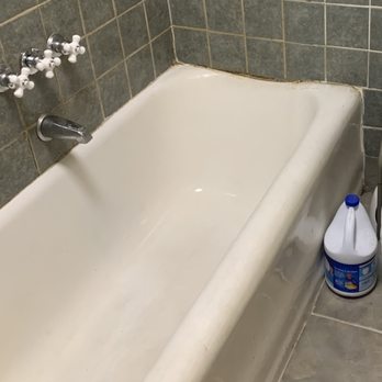 Supreme Bath Refinishing - Before the tub had corrosion and the tiles were dingy. - Refinishing Services Near Me