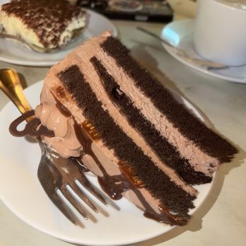 Caffé Vittoria - Chocolate Mousse Cake (tiramisu in back) - Coffee & Tea Near Me - Boston, Massachusetts Caffé Vittoria - Chocolate Mousse Cake (tiramisu in back) - Coffee & Tea Near Me - Boston, Massachusetts