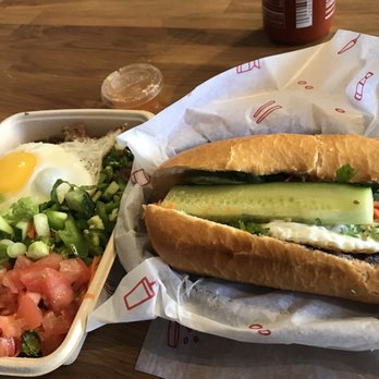 Sizzle&Crunch - Left: grilled pork rice bowl with egg Right: grilled beef banh mi - Vietnamese Near Me - Seattle, Washington Sizzle&Crunch - Left: grilled pork rice bowl with egg Right: grilled beef banh mi - Vietnamese Near Me - Seattle, Washington