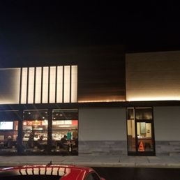 the outside of a restaurant at night