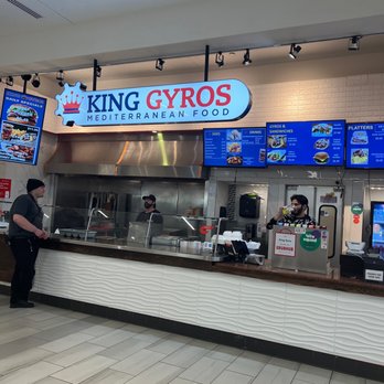 King Gyros - a man standing in front of the counter - Mediterranean Near Me - Knoxville, Tennessee King Gyros - a man standing in front of the counter - Mediterranean Near Me - Knoxville, Tennessee
