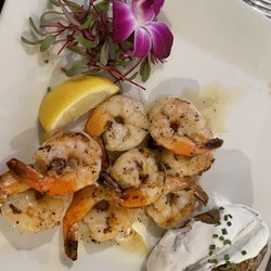 Chew 62 - Grilled shrimp with a baked potato as a side