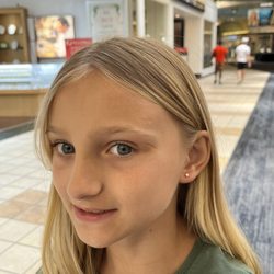 Piercing Pagoda - My second oldest modeling her new earrings