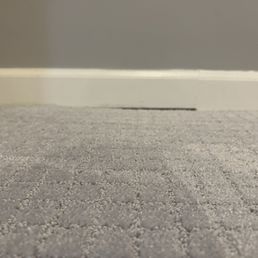 Large groove where baseboard doesn't meet carpet