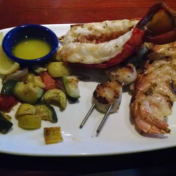 Red Lobster - Wood grilled lobster, scallop, and shrimp with veggies over wild rice - Seafood Near Me - Pittsburg, California Red Lobster - Wood grilled lobster, scallop, and shrimp with veggies over wild rice - Seafood Near Me - Pittsburg, California