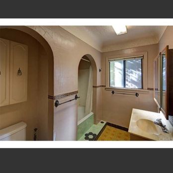 Seabreeze Renovators - Bathroom BEFORE. Team converted bath to walk in shower - General Contractors Near Me