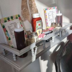 Pandarella’s Breakfast & Lunch - Wall shelf with condiments.