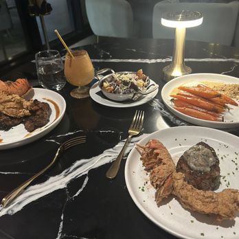 Bungalow Downtown Dining - 8oz Filet Mignon Lobster Tail 16oz Prime Cajun Marinated Ribeyecajun - Steakhouses Near Me - Houston, Texas Bungalow Downtown Dining - 8oz Filet Mignon Lobster Tail 16oz Prime Cajun Marinated Ribeyecajun - Steakhouses Near Me - Houston, Texas