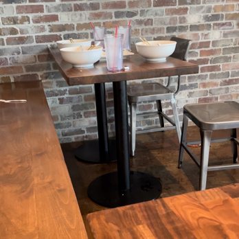 Oni Ramen - Dirty dishes on the side of our table/booth from the time we walked in to halfway through our time eating. Yet, it was empty?! - Ramen Near Me - Richardson, Texas