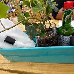 Cute holders of silverware on the picnic tables