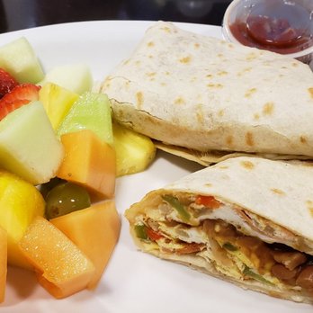 Tutti Frutti Breakfast and Lunch - A side view of my breakfast burrito. It doesn't look huge but it was very filling.  Lots of fruit was included. - Breakfast & Brunch Near Me - Edmonton, Alberta