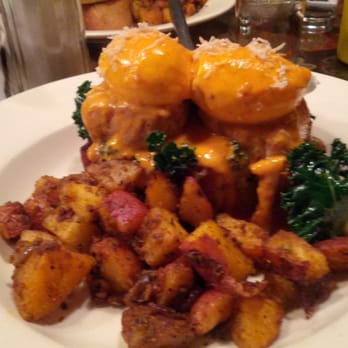Julians - The Nelson full size smoked pork loin, lemon peppered kale, sweet chili hollandaise, & fresh horseradish, over house corn bread - New American Near Me - Providence, Rhode Island Julians - The Nelson full size smoked pork loin, lemon peppered kale, sweet chili hollandaise, & fresh horseradish, over house corn bread - New American Near Me - Providence, Rhode Island