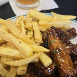 Brittany's Restaurant and Lounge - Jamaican jerk chicken wings and fries