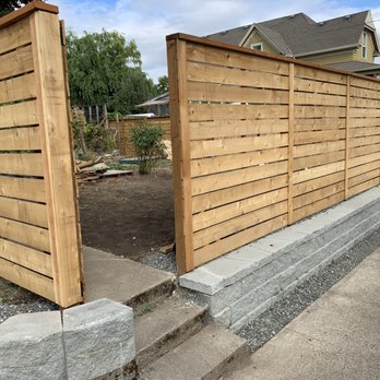 Dairy Factory - a wooden fence and steps leading to a house - General Contractors Near Me Dairy Factory - a wooden fence and steps leading to a house - General Contractors Near Me