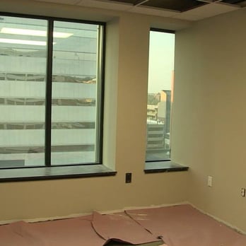 Moore and Moore - empty room with large windows - Painters Near Me Moore and Moore - empty room with large windows - Painters Near Me