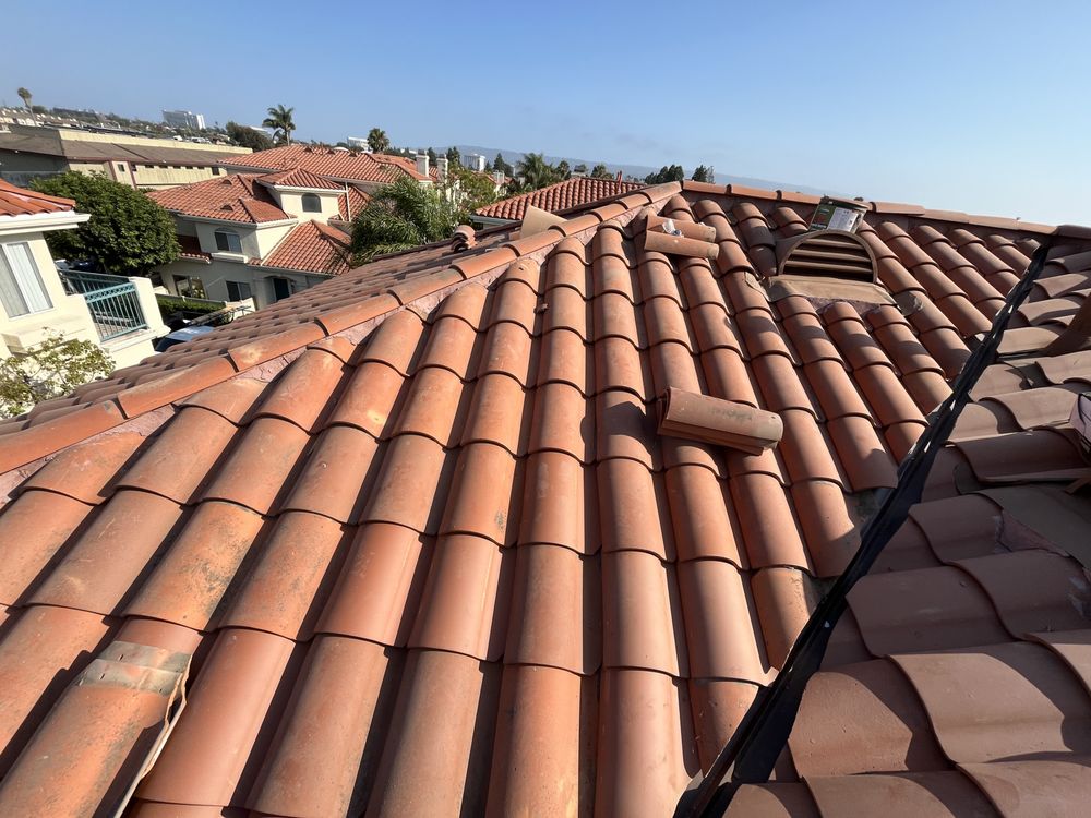 Slide of T’s Roofing 