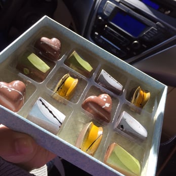 Chocolaterie - Ginger bread (the heart), sage honey (the yellow one), cookies and cream (the black & white one), and pistachio (the green one) - Chocolatiers & Shops Near Me - Berkeley, California Chocolaterie - Ginger bread (the heart), sage honey (the yellow one), cookies and cream (the black & white one), and pistachio (the green one) - Chocolatiers & Shops Near Me - Berkeley, California