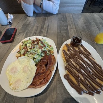 Daylight Grill - Ceaser salad, over easy eggs, bacon, sausage, peameal bacon, buttermilk pancakes with Nutella - Breakfast & Brunch Near Me - Burlington, Ontario