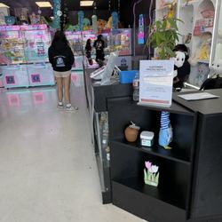 Clawzania - The staff is very nice and can give helpful hints so you can maybe win a toy.